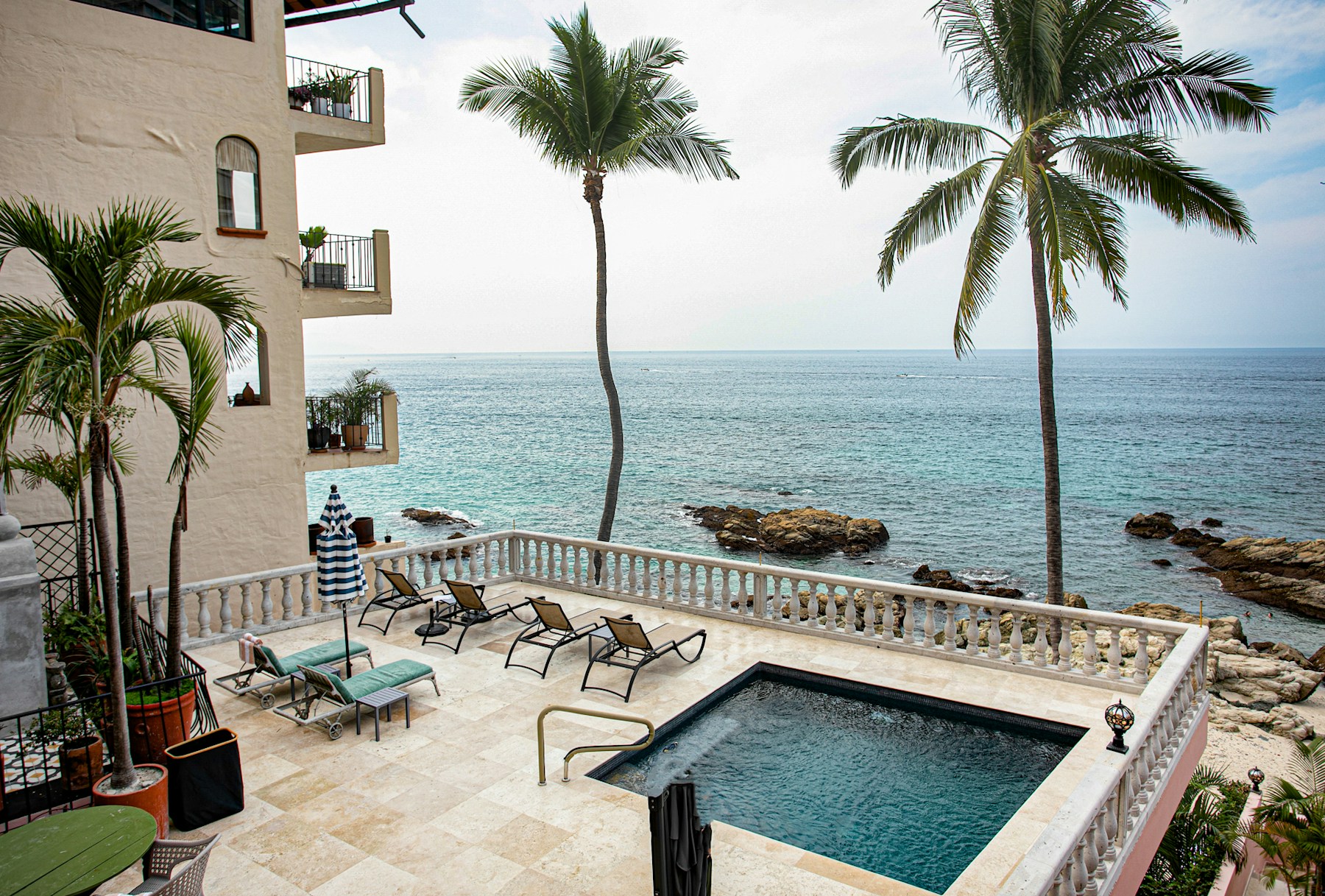 The oceanfront pool, palms and Pacific views at Quinta Maria Cortez